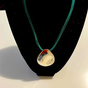 Agua marine  leather chain with silver oval drop.